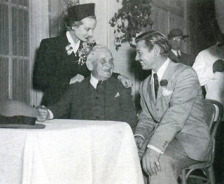 Clark Gable and Carole Lombard chat with Clark's uncle Charlie at the premiere of Gone with the Wind in Atlanta, December 1939.  